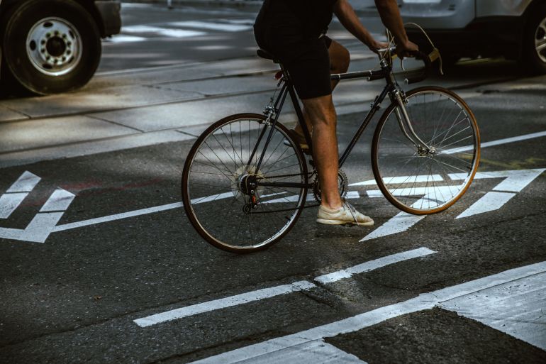 man-riding-in-city-bike-lane.jpg
